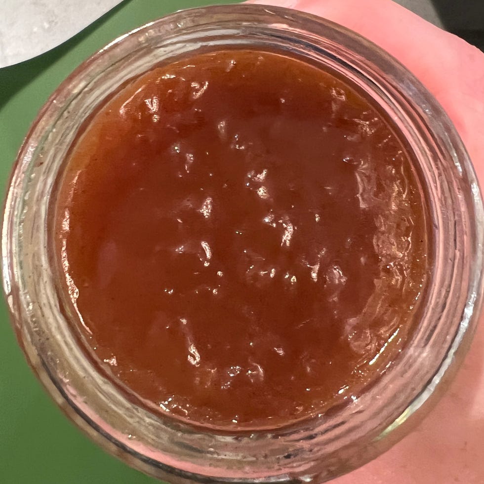 top view of apple pie spread in glass jar