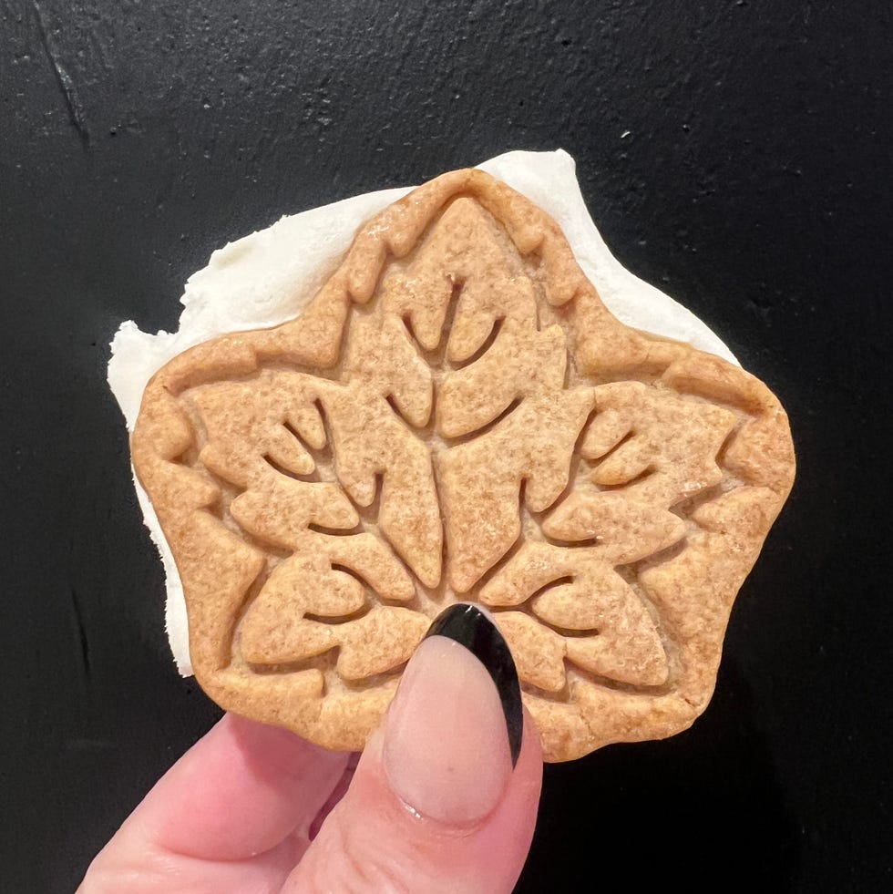 hand holding maple leaf shaped ice cream sandwich