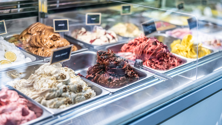 Different flavors of ice cream on display at an ice cream shop