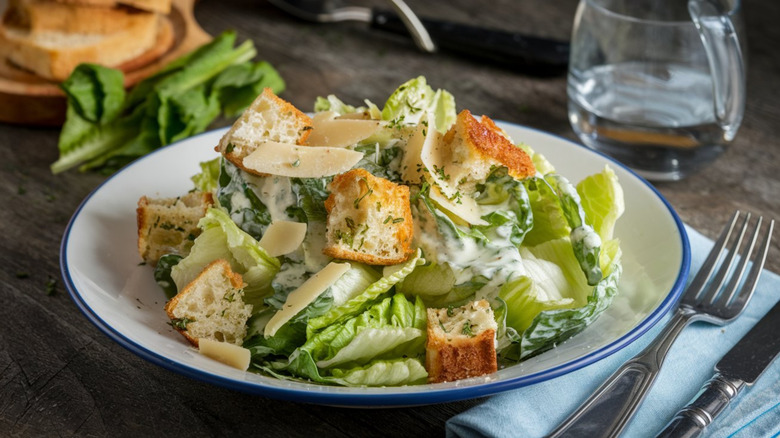 Crisp romaine lettuce tossed with Parmesan, croutons, and a creamy Caesar dressing