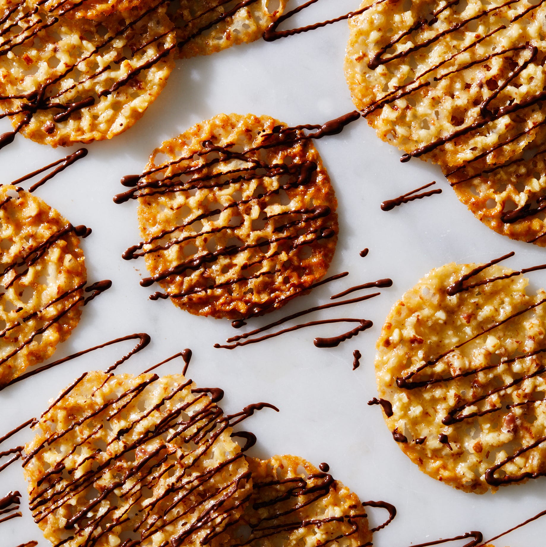 golden lace cookie drizzled with chocolate