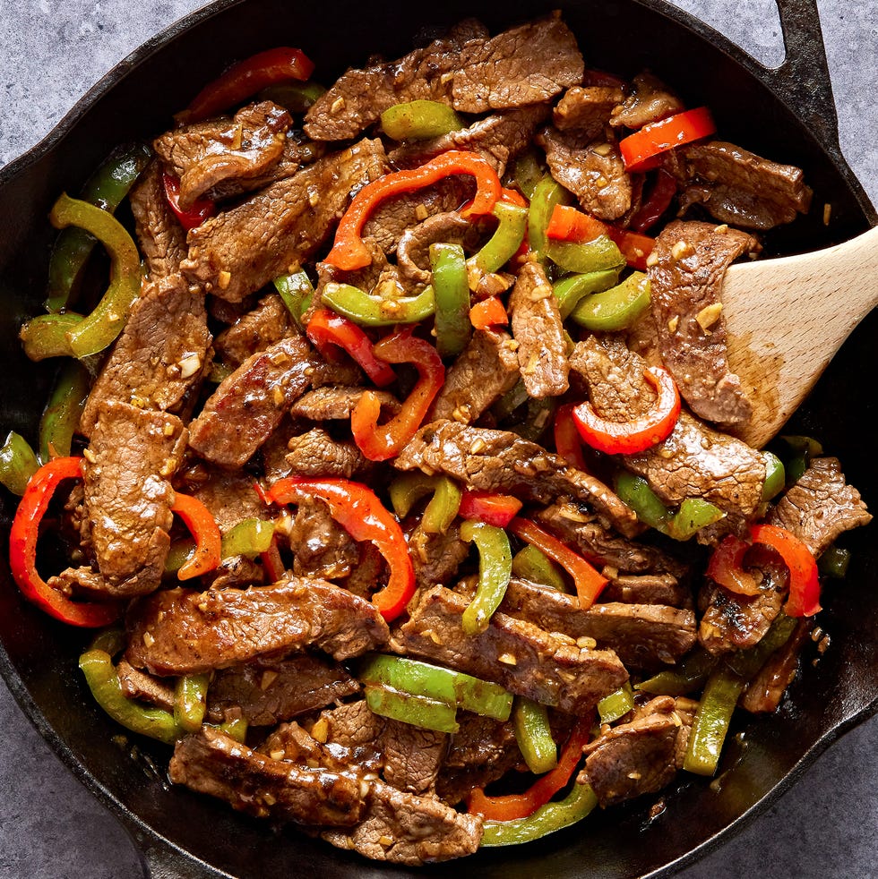 Pepper Steak steak with sliced red and green peppers