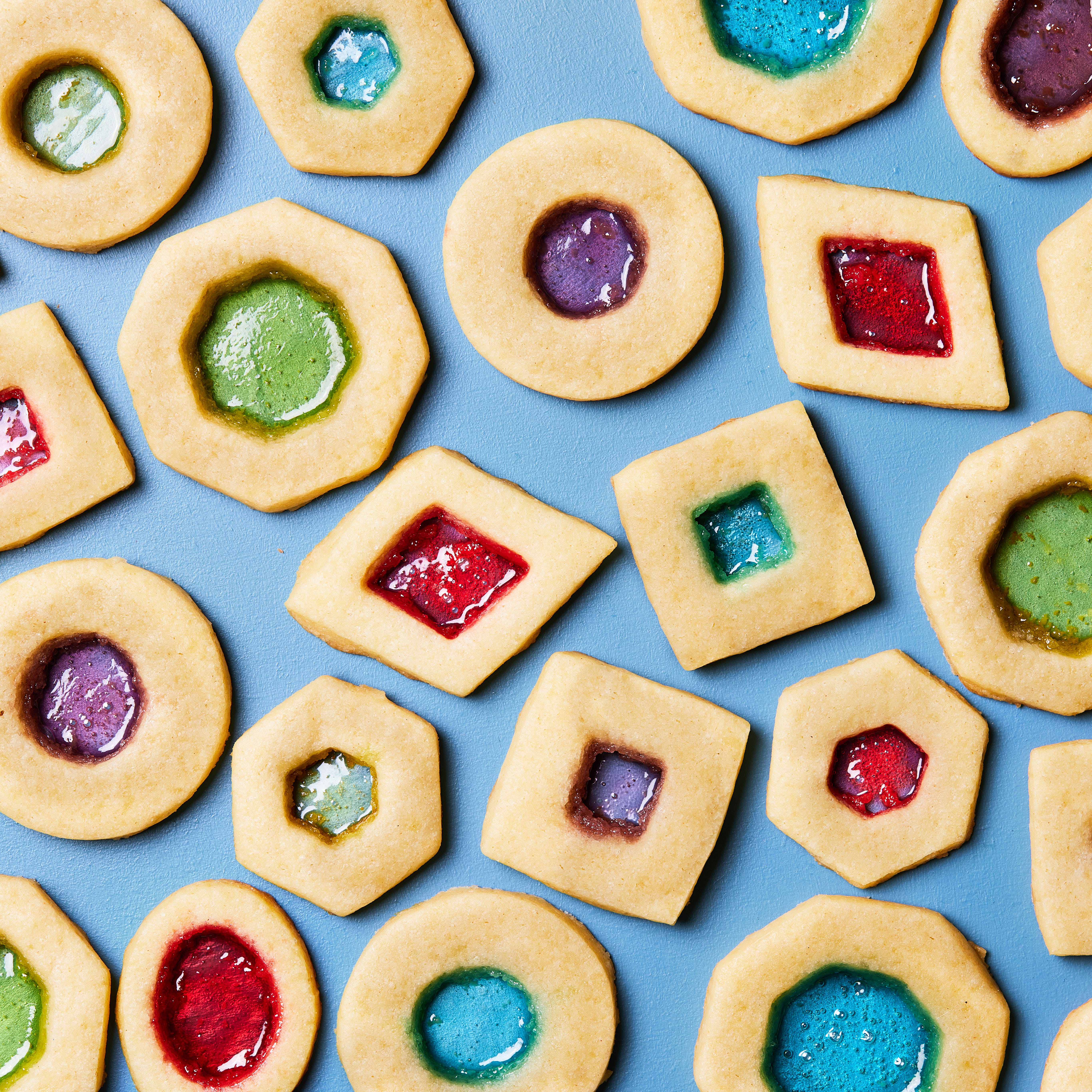sugar cookies with cutouts filled with melted jolly ranchers to look like stained glass