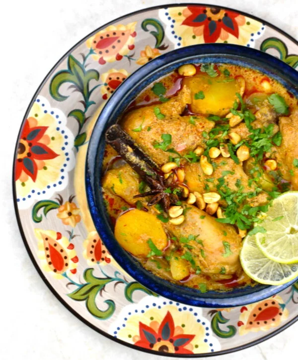 Bowl of massaman curry atop the Gypsy Plate.