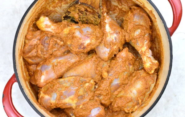 Chicken added to the pot.