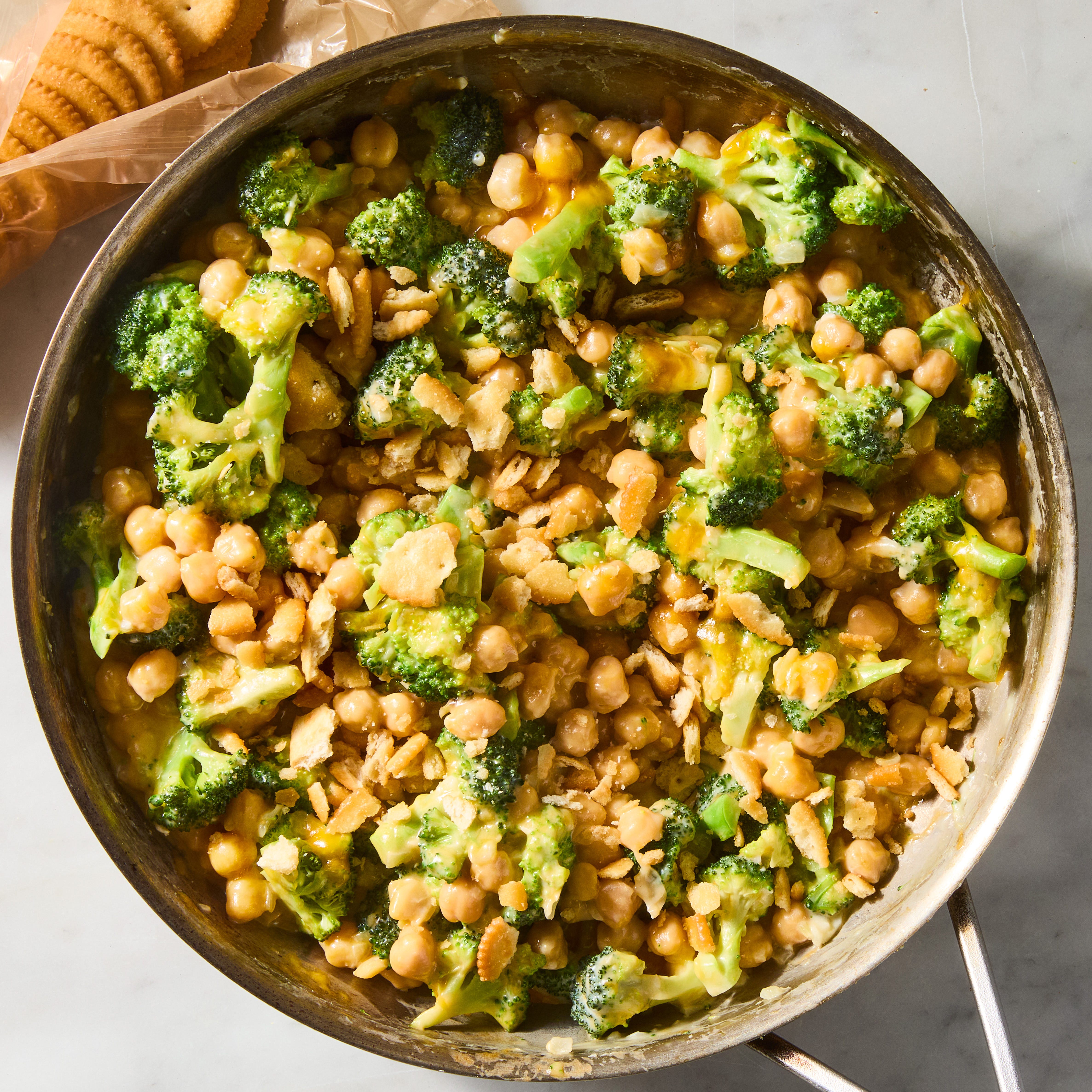 Cheesy broccoli cheddar chickpea skillet cheesy broccoli cheddar chickpeas in a skillet topped with crushed ritz crackers